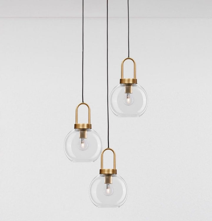 Elegant Glass Globe Pendant Light Trio with Brass Accents