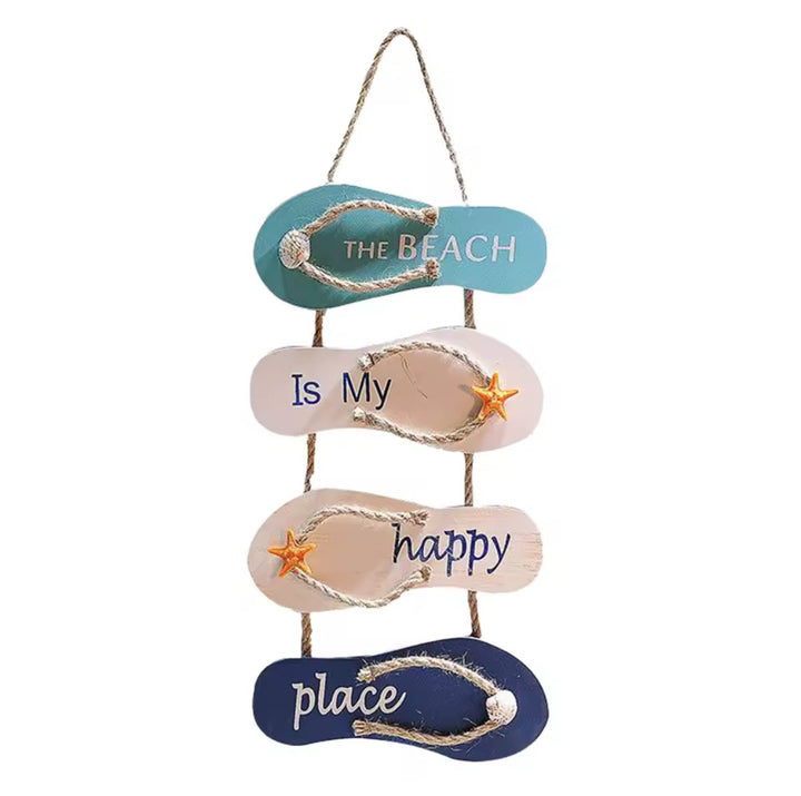 Beach-themed wall decor made of wooden flip-flops with the phrase "The Beach Is My Happy Place"