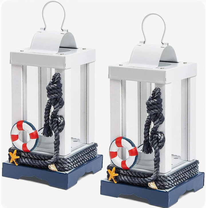 Nautical decorative lantern in white and navy with rope, lifebuoy, and starfish accents