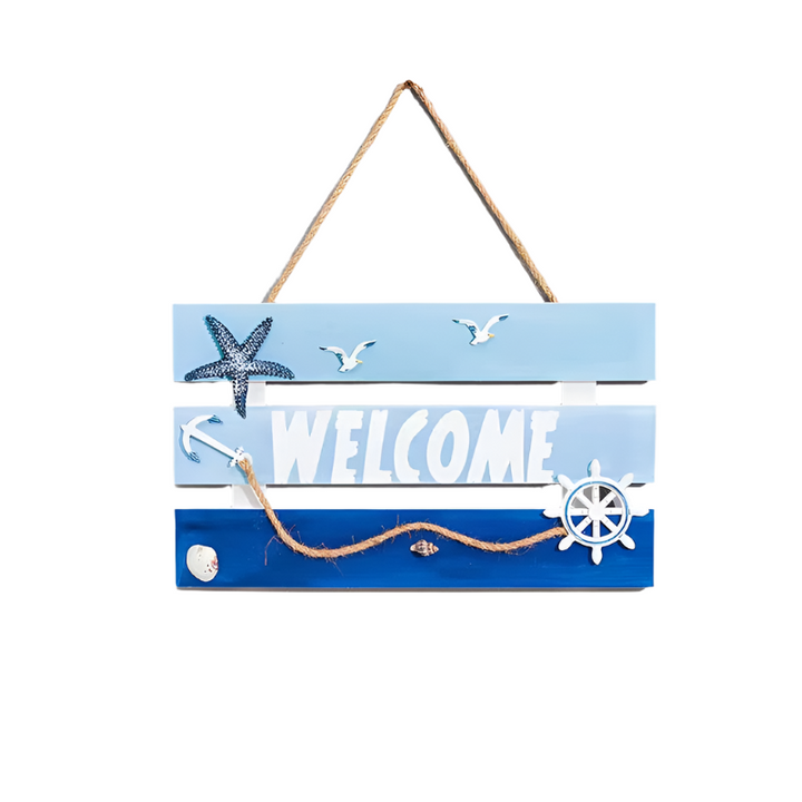 Decorative wooden sign with 'Welcome' text, starfish, seagulls, and a ship's wheel on a blue background.