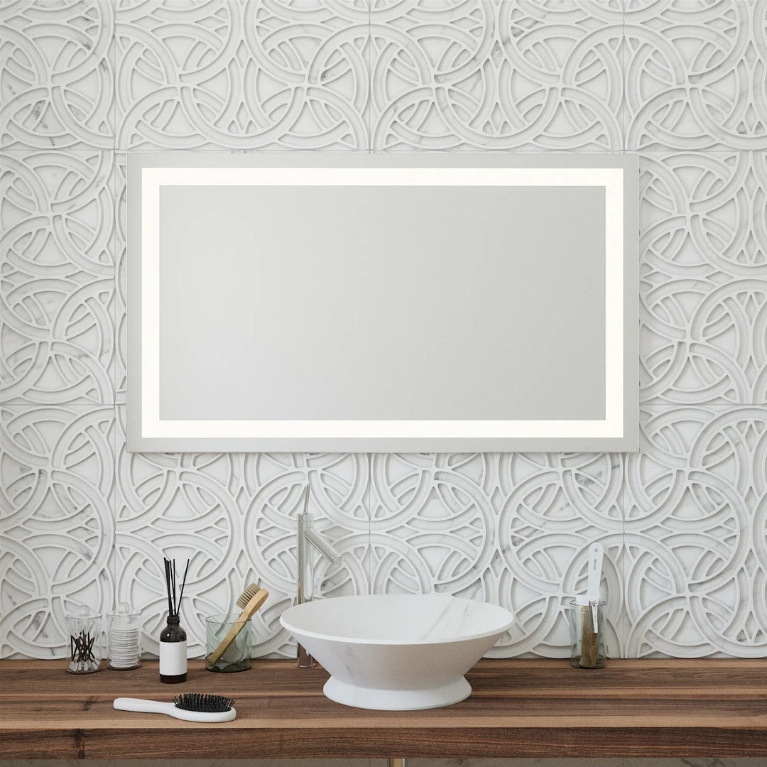 Frameless rectangular mirror with inner LED border above modern sink and decorative wall