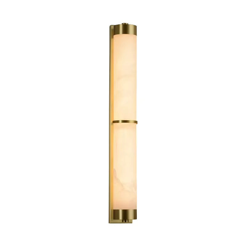 Modern vertical brass wall light with a cylindrical opal glass shade