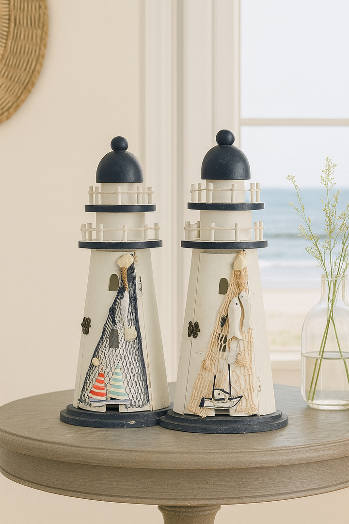 Decorative nautical lighthouse with sailboats, seashells, and netting