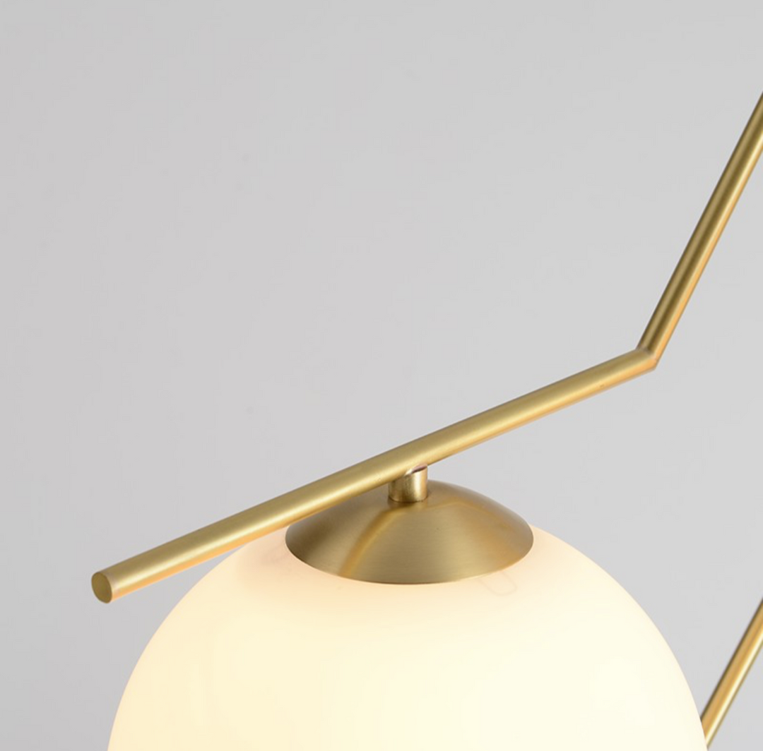 Modern Three-Globe Pendant Light with Brass Finish