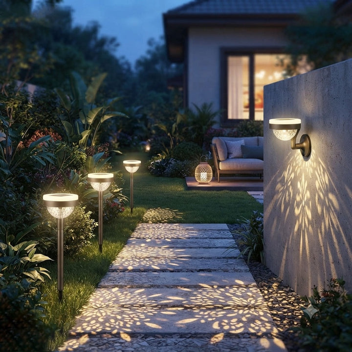 Two black-and-white solar outdoor lights, one with a garden stake and one wall-mounted