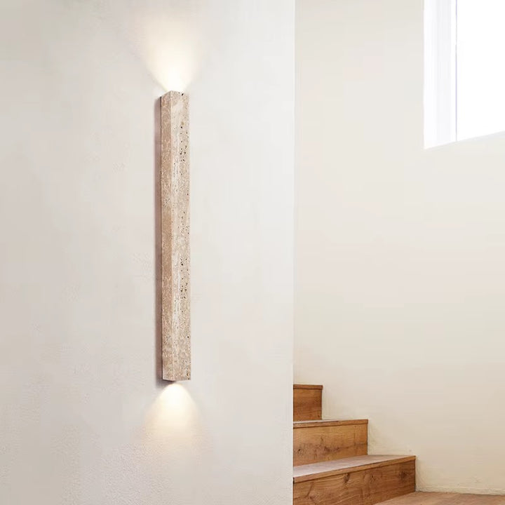 Modern beige travertine up and down LED wall sconce on staircase wall