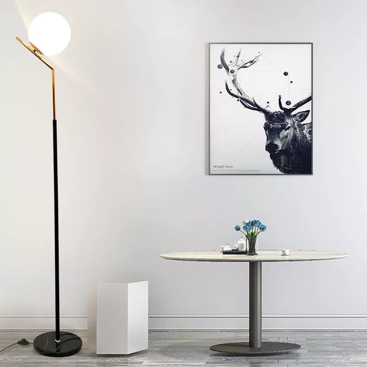 Modern Floor Lamp with Spherical Light and Black Base