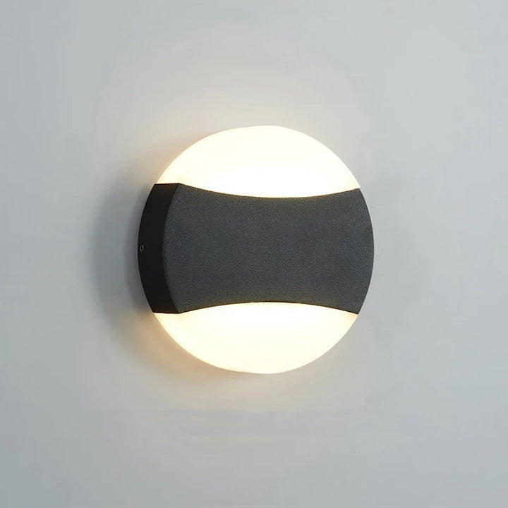 Modern LED Wall Light with Circular Design and Black Accents