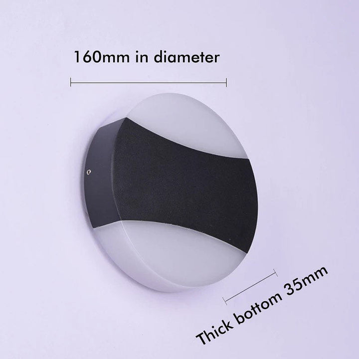 Modern LED Wall Light with Circular Design and Black Accents