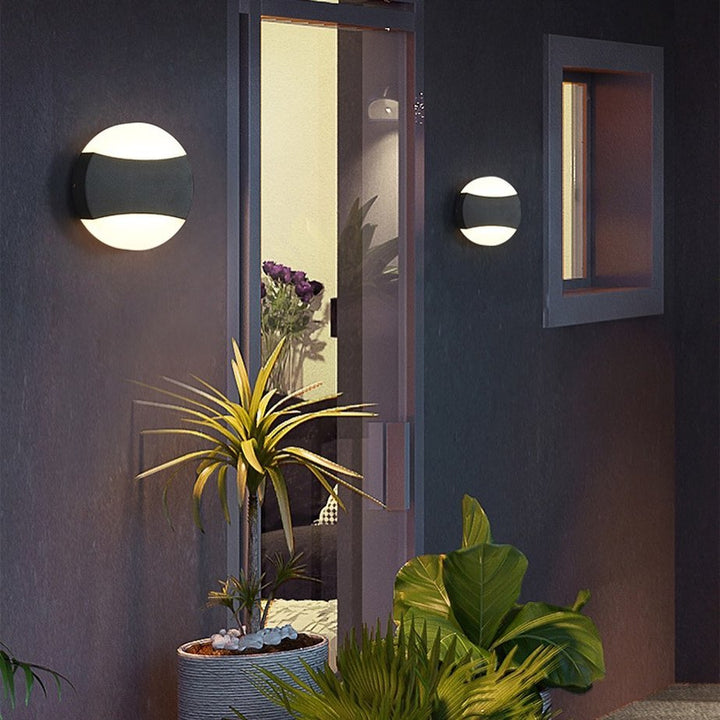 Modern LED Wall Light with Circular Design and Black Accents