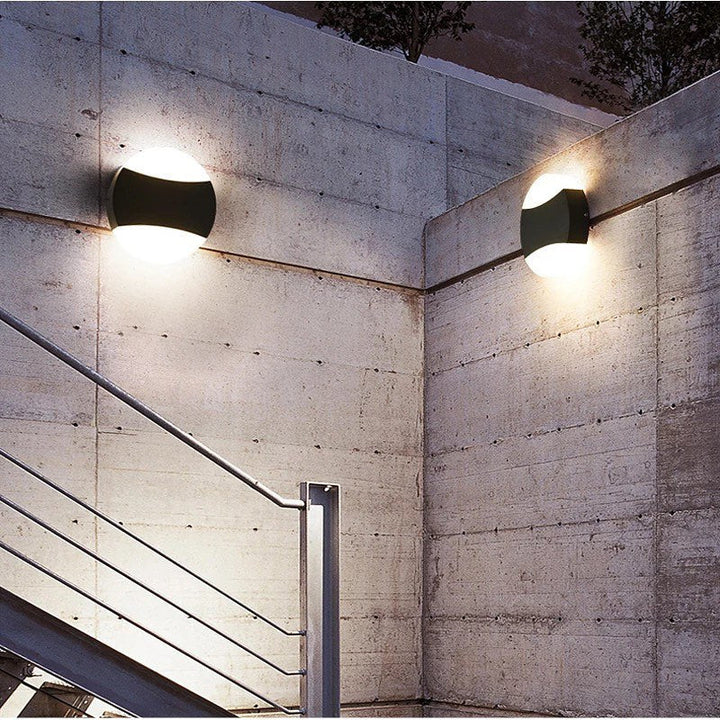 Modern LED Wall Light with Circular Design and Black Accents