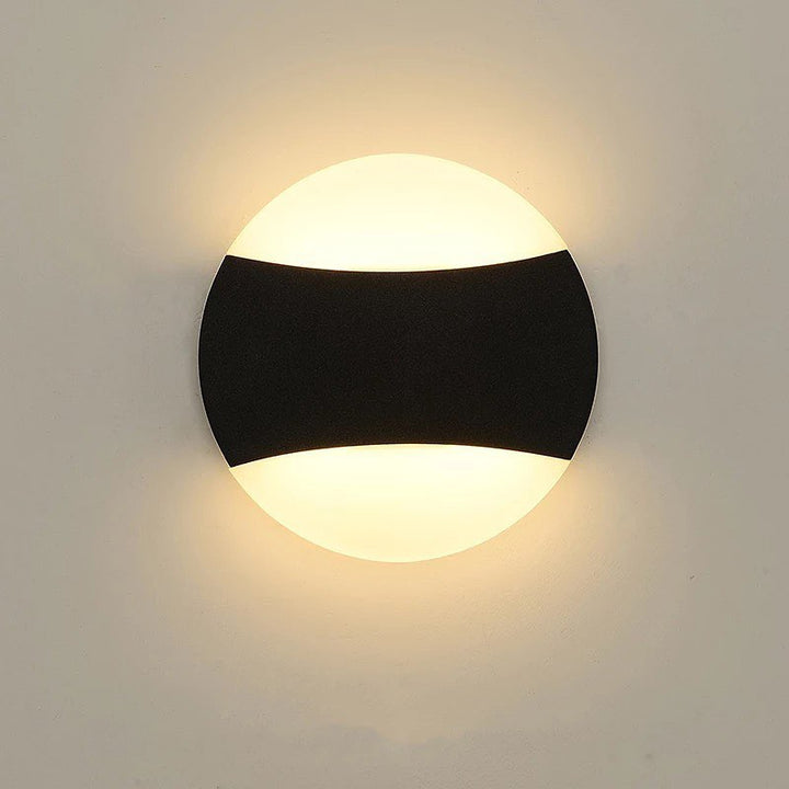 Modern LED Wall Light with Circular Design and Black Accents