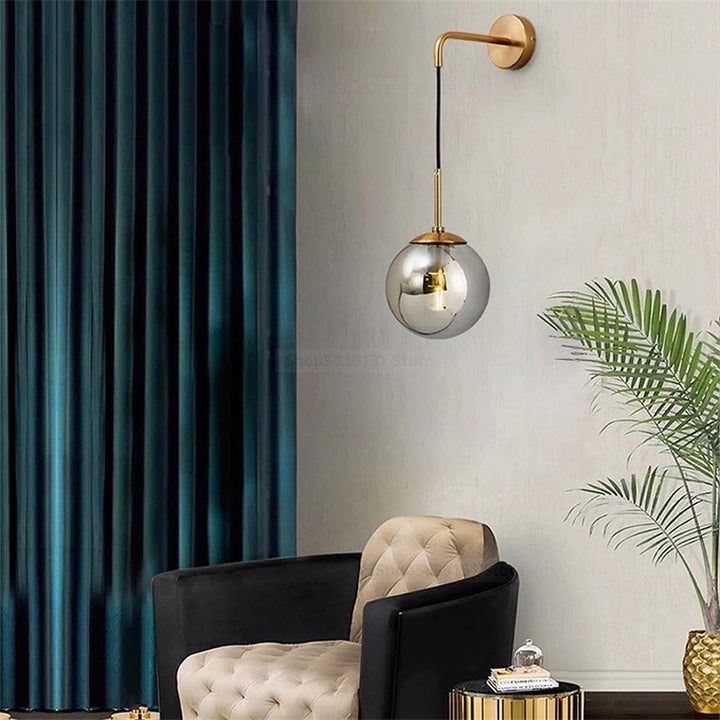 Modern Wall Light with Gold Finish and Glass Globe Shade