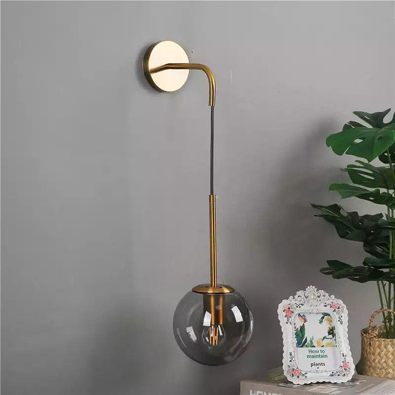 Modern Wall Light with Gold Finish and Glass Globe Shade