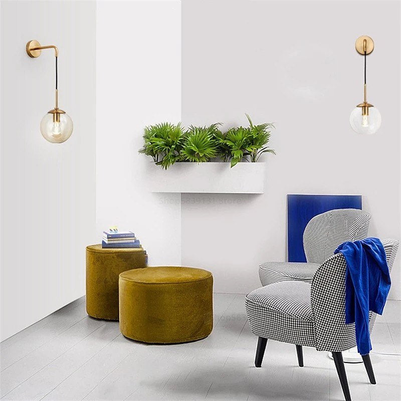 Modern Wall Light with Gold Finish and Glass Globe Shade