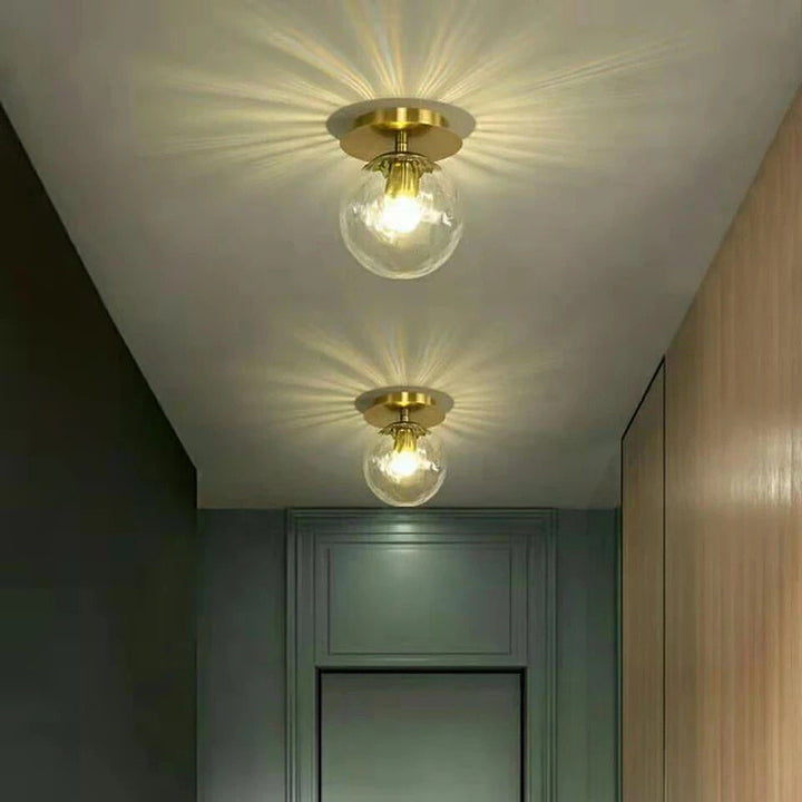 Modern Brass Ceiling Light with Frosted Glass Globe