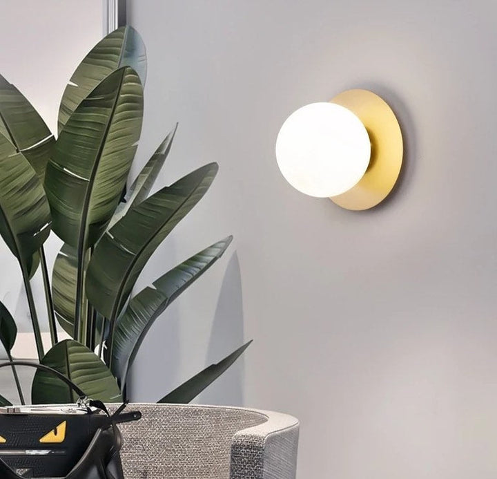 Modern Brass Wall Light with Circular Globe Shade