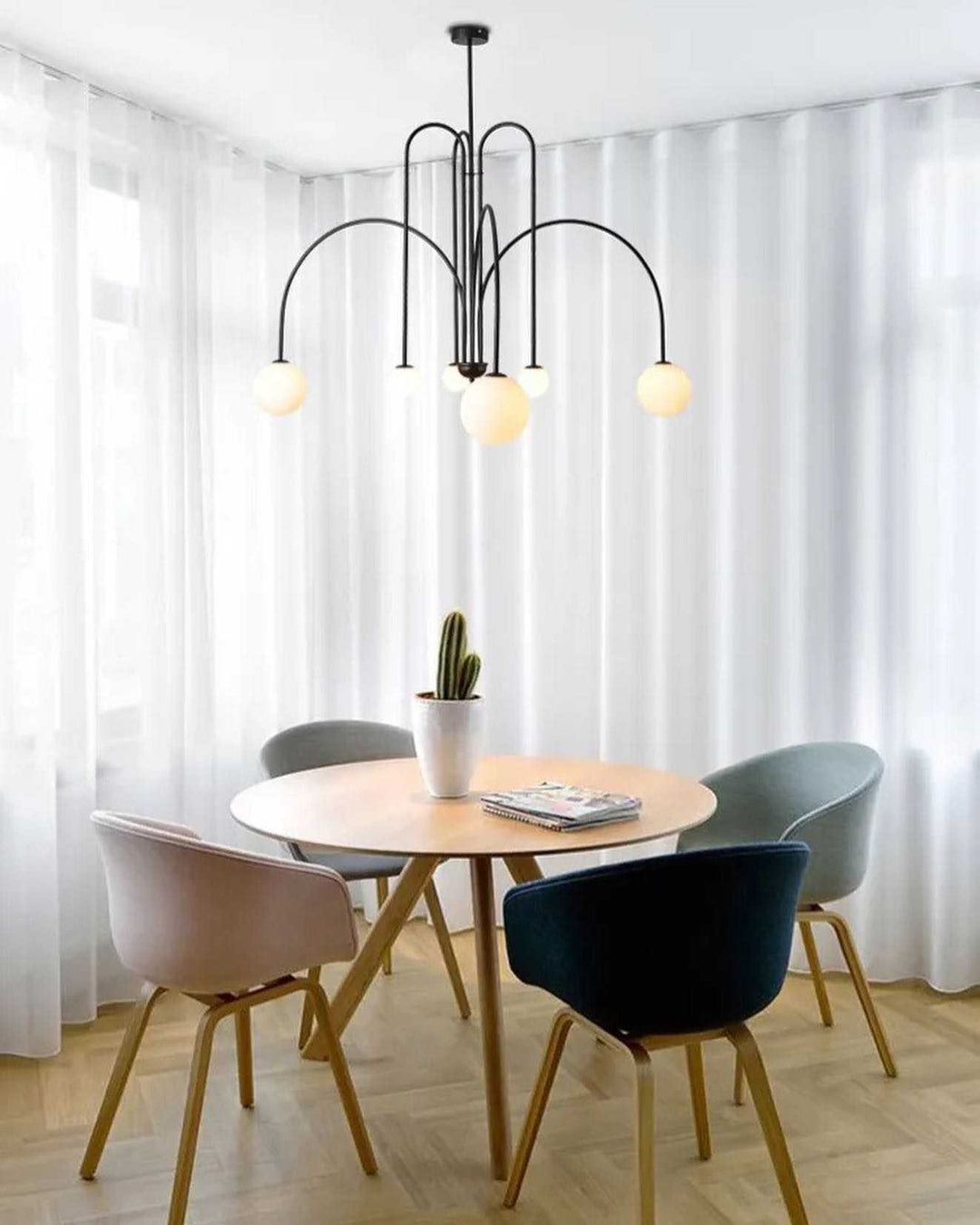 Modern Dining Room ChandelierModern Dining Room ChandelierSleek and modern dining room chandelier with spherical globes, perfect for contemporary interiors.ChandeliersWadi Home