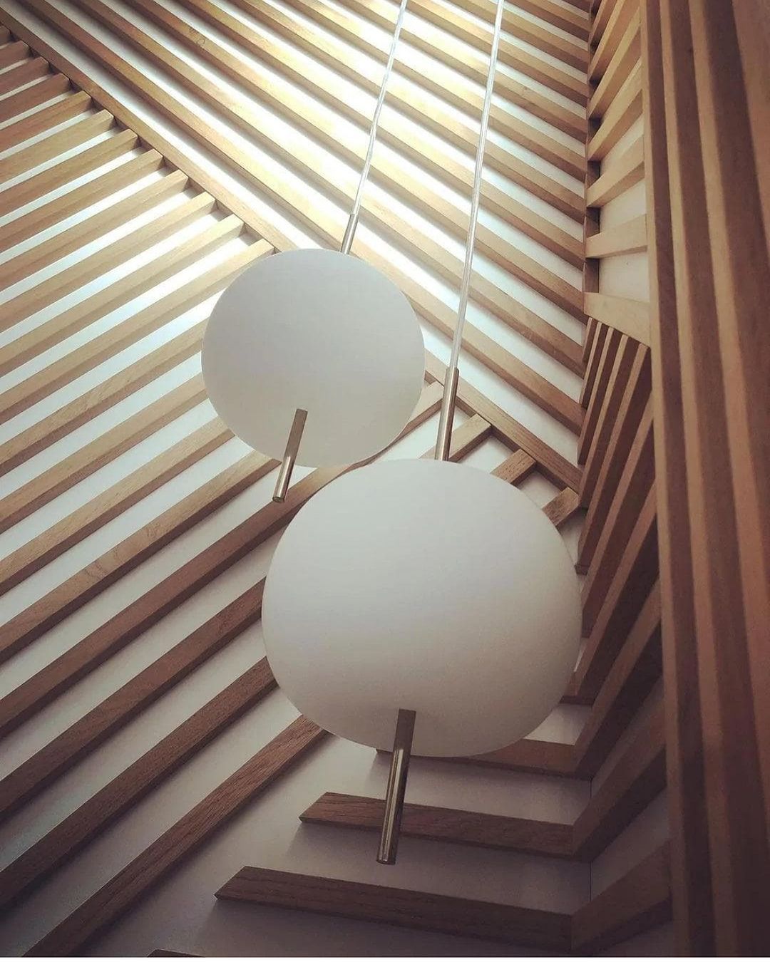 Minimalist White Globe Pendant Light with Brass Accent