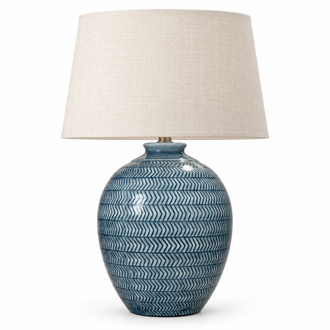 Blue patterned ceramic table lamp with a beige fabric shade
