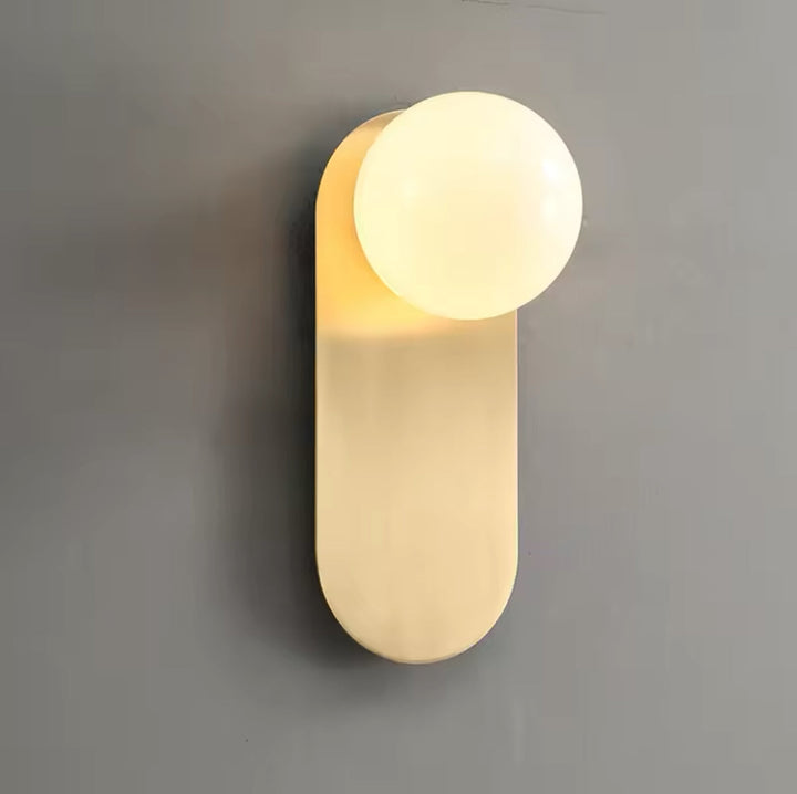 Modern Minimalist Wall Light with Soft Gold Base and Globe Shade