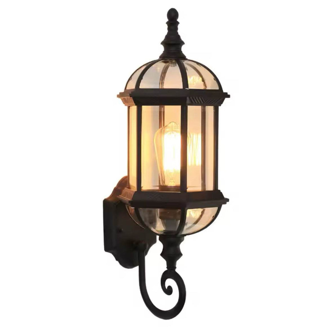 Outdoor Wall LanternOutdoor Wall Lantern with Glass Panels and Vintage DesignThis outdoor wall lantern features a vintage-inspired design with clear glass panels and a durable black metal frame. 
 Perfect for gardens, patios, or entryways, itOutdoor LightsWadi Home