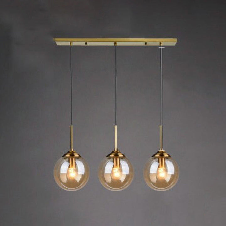 Modern 5-Light Globe Pendant Light with Smoked Glass and Brass Finish