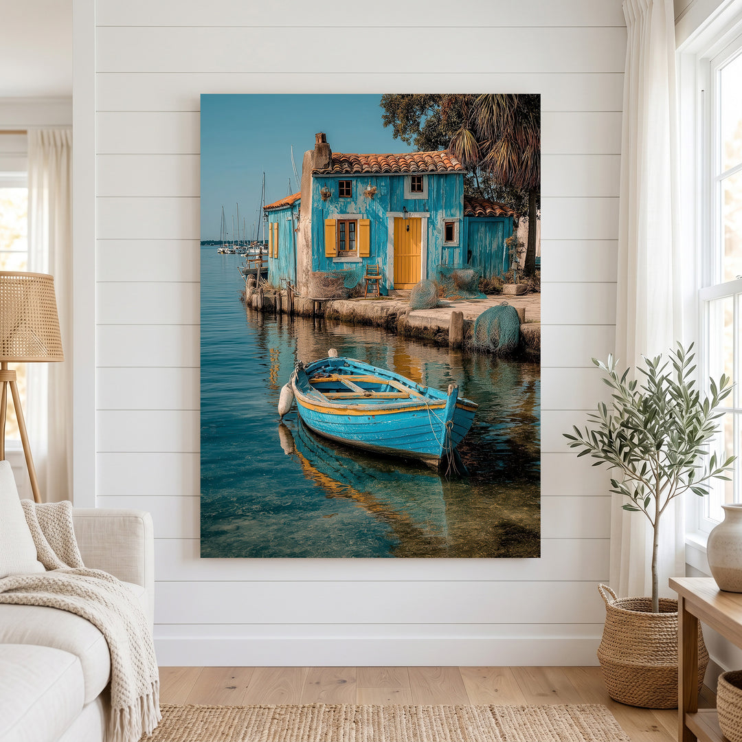Mediterranean blue house and wooden boat on calm turquoise water canvas art