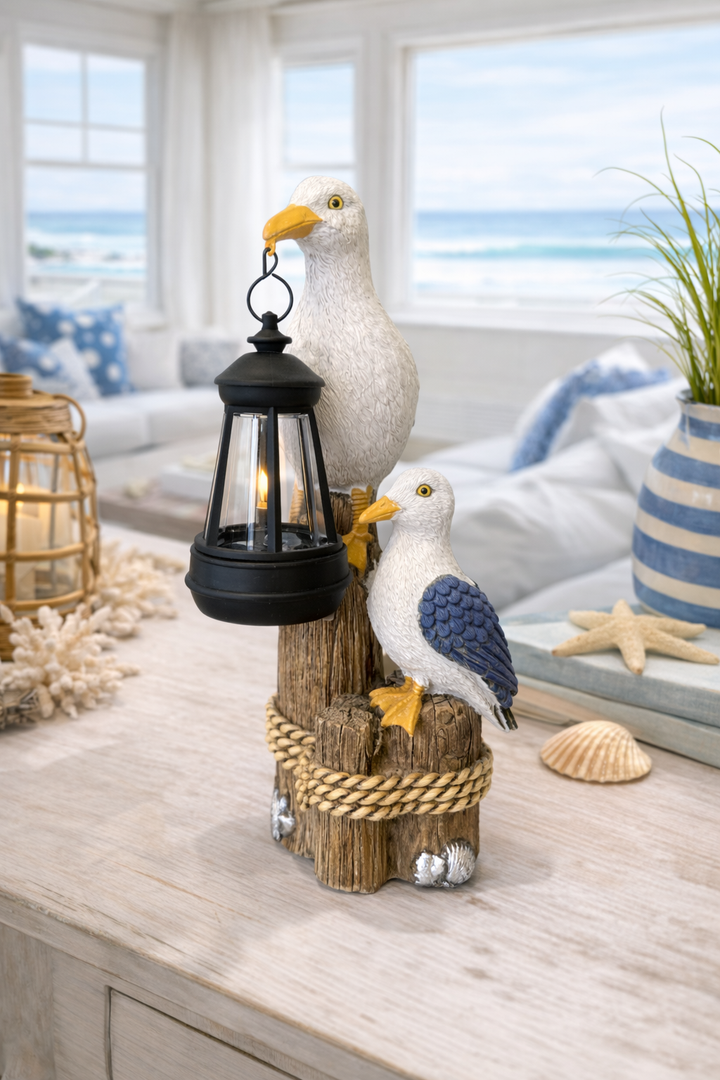 Seaside pelican holding hanging lantern coastal home decor with ambient lighting