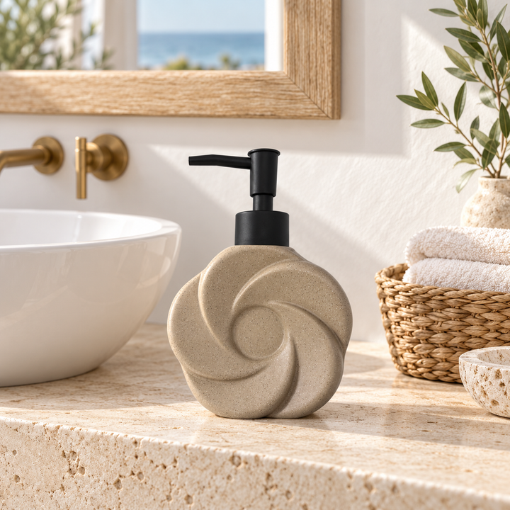 Sculptural beige ceramic soap dispenser with spiral relief and black pump on a bathroom countertop