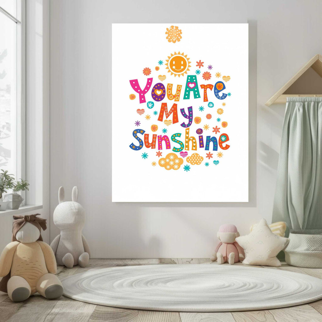 You Are My Sunshine kids canvas art with bright typography, colorful flowers, hearts, stars, and smiling sun in MDF frame