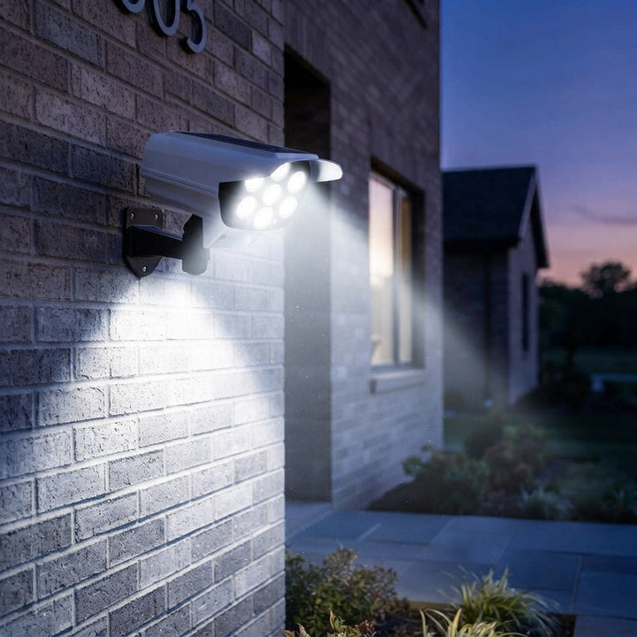 Modern outdoor wall-mounted LED security light illuminating a brick exterior at dusk