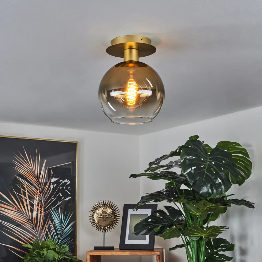 Modern Amber Glass Globe Ceiling Light with Brass Base