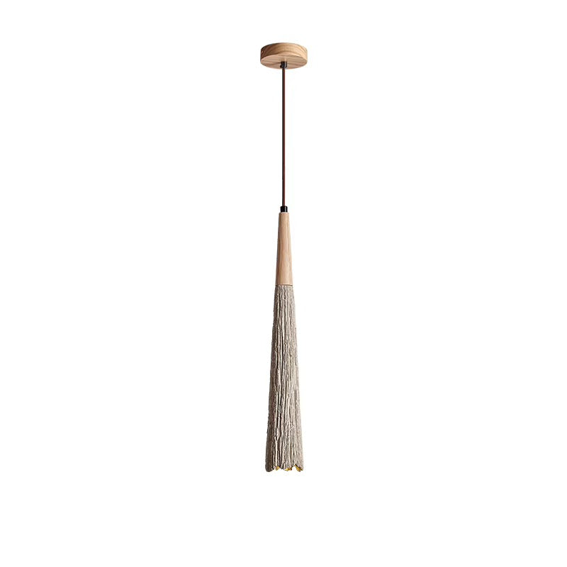 Slim pendant light with a long natural-fiber tassel shade, dark cord, and round wood-look ceiling canopy