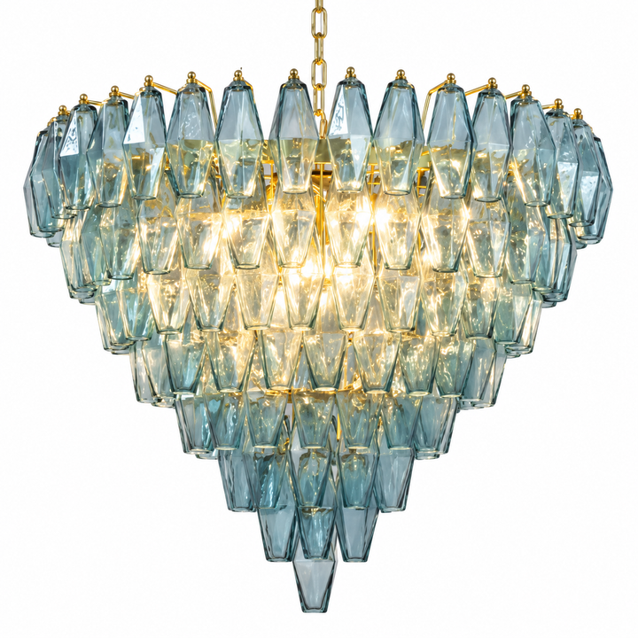 Blue-gray faceted glass chandelier with layered crystal elements and a warm gold-tone finish