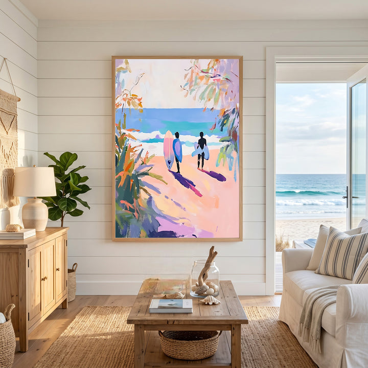 Wadi Home artwork: Two surfers walk towards the ocean carrying surfboards. Impressionistic beach scene with pink sand, blue sea, and lush foliage.
