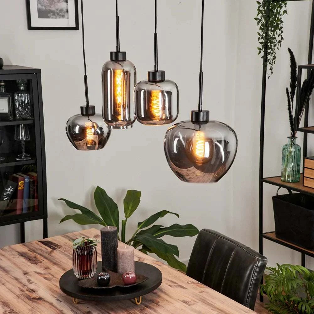 Modern Smoke Glass Pendant LightModern Smoke Glass Pendant Light Cluster with Mixed ShapesThis modern pendant light cluster features a unique arrangement of smoke glass shades in various shapes, each with an exposed filament bulb for a warm, ambient glow.Pendant LightingWadi Home