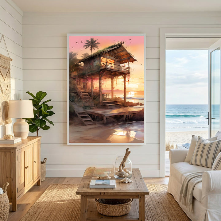 Wadi Home tropical beach house wall art at sunset. Watercolor painting of a stilt house on a beach with palm trees.