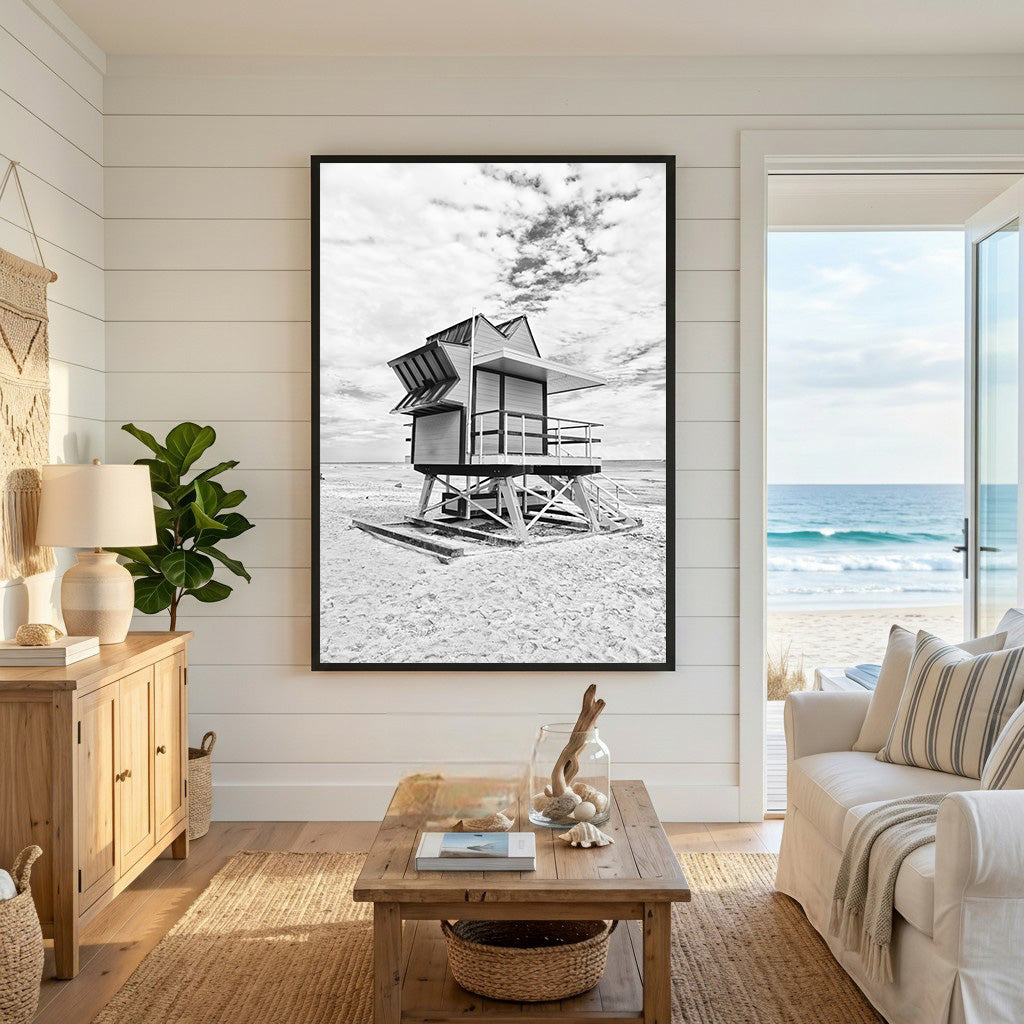 Wadi Home black and white framed print of a lifeguard tower on a sandy beach under a cloudy sky.