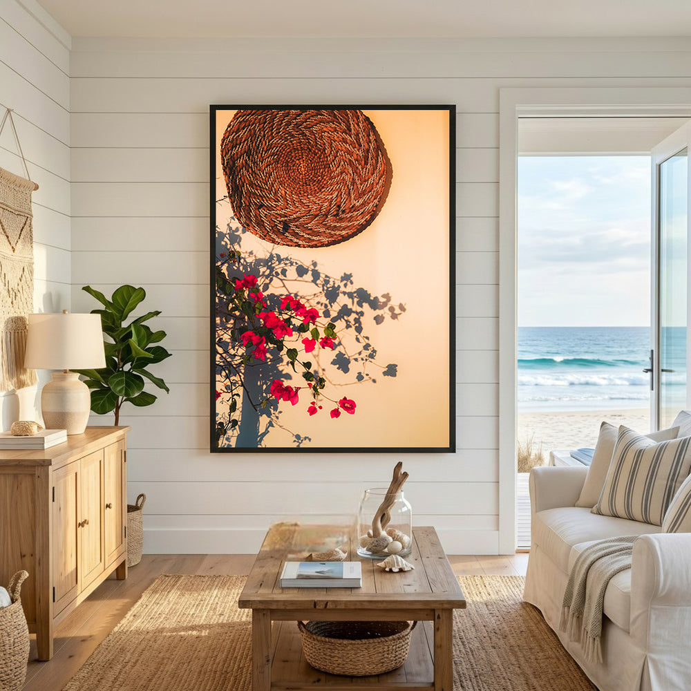 Wadi Home woven basket and vibrant bougainvillea wall art with shadows on a warm background.