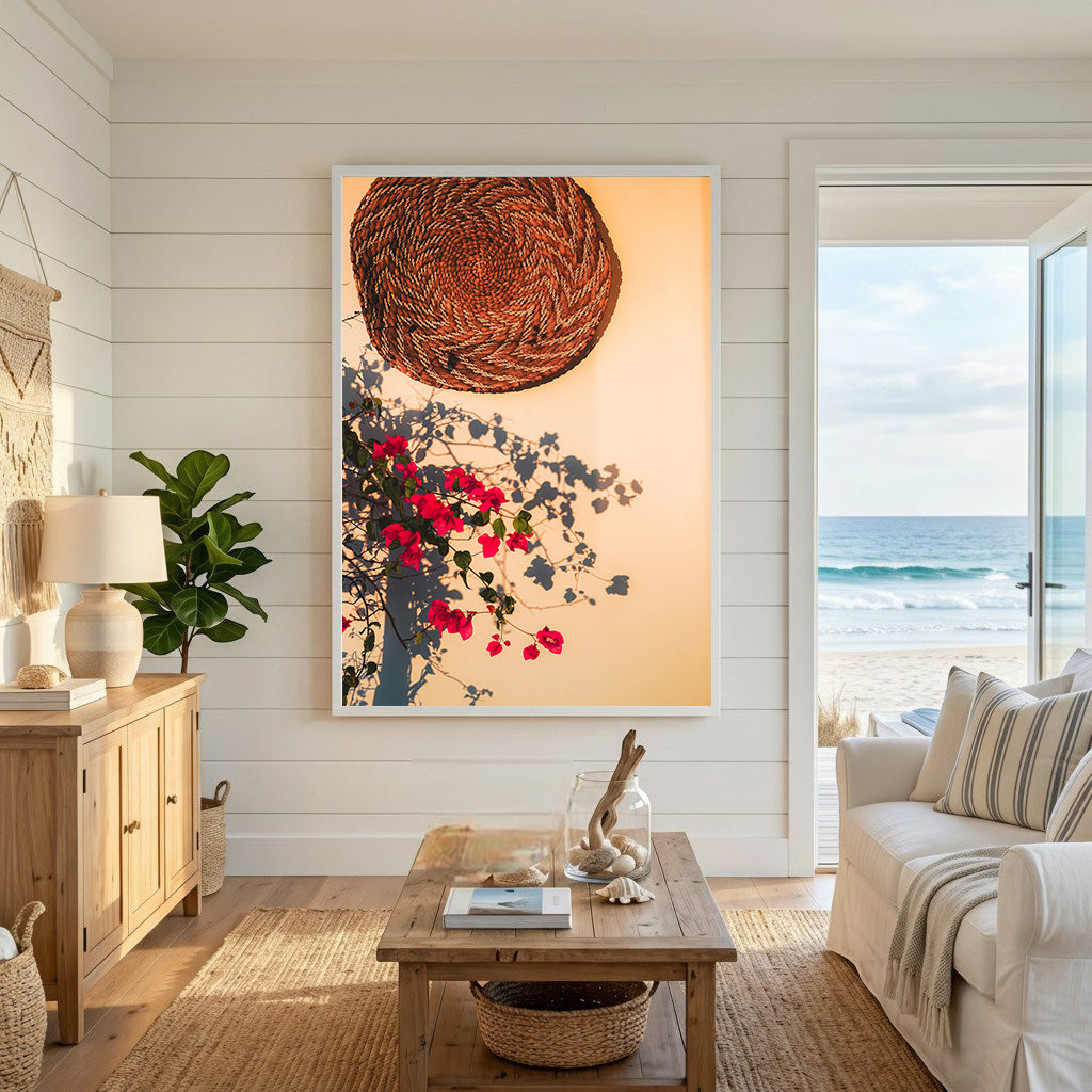 Wadi Home woven basket wall art with vibrant pink bougainvillea blossoms and shadows.