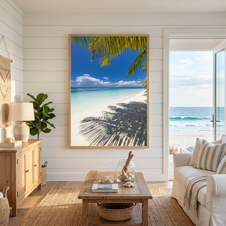 Wadi Home tropical beach wall art with palm tree shadows on white sand and turquoise water under a blue sky.