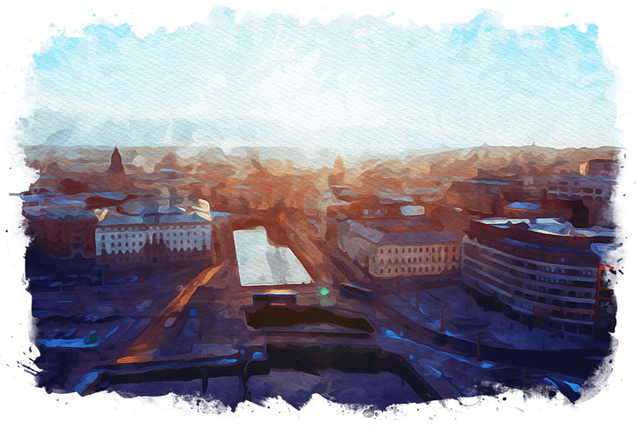 Wadi Home Cityscape Sunrise Watercolor Wall Art featuring a vibrant watercolor painting of a city at dawn with warm oranges and deep blues.