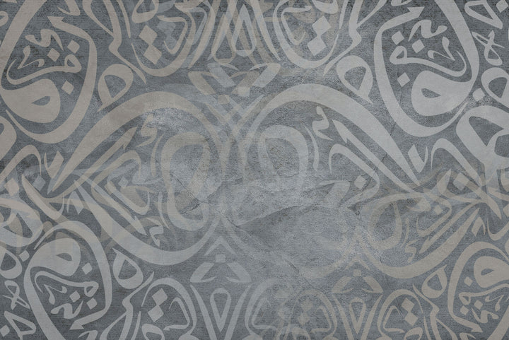 Wadi Home abstract Arabic calligraphy art in grey tones, framed and displayed above a sofa.