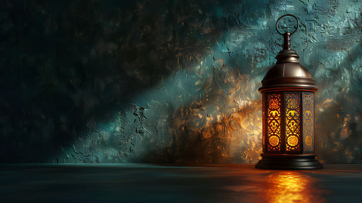 Wadi Home vintage lantern illuminated wall art with intricate details and warm glow, casting dramatic light and shadow.