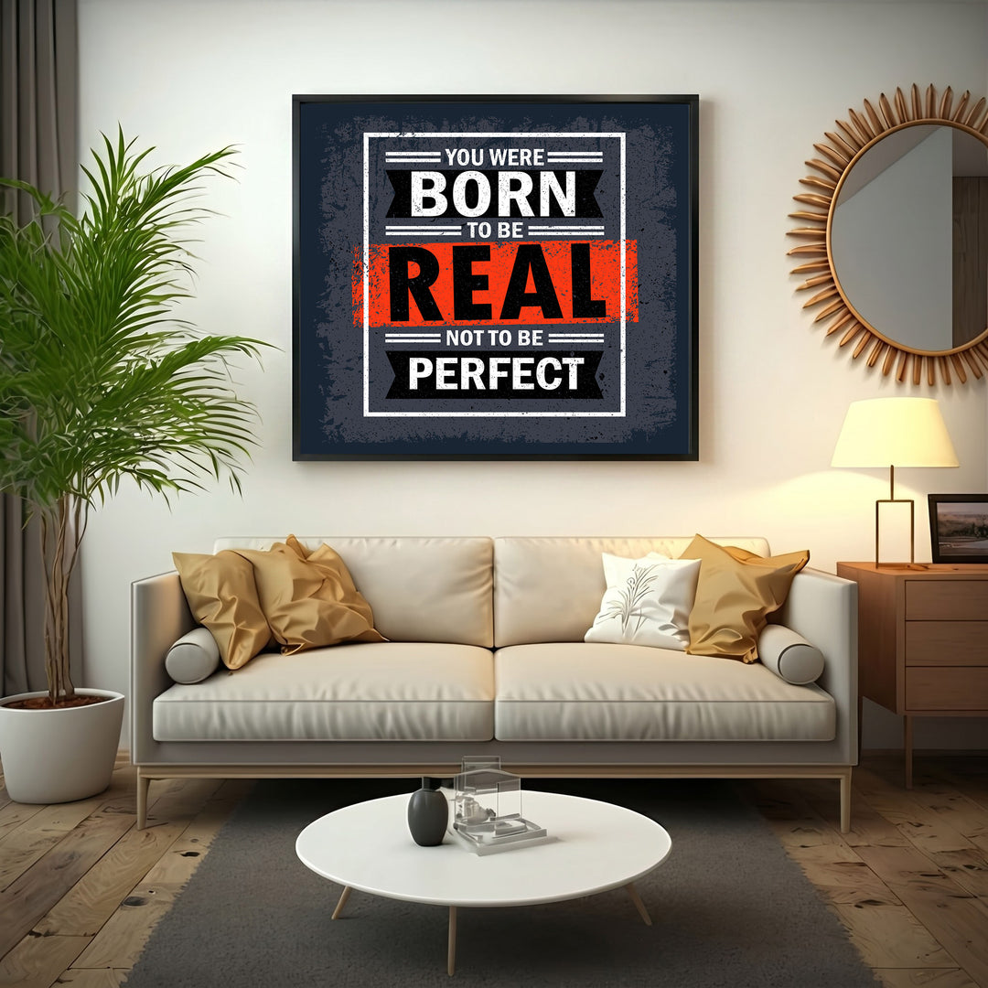 Wadi Home motivational wall art with bold text "You Were Born To Be Real Not To Be Perfect" in black, white, and red.
