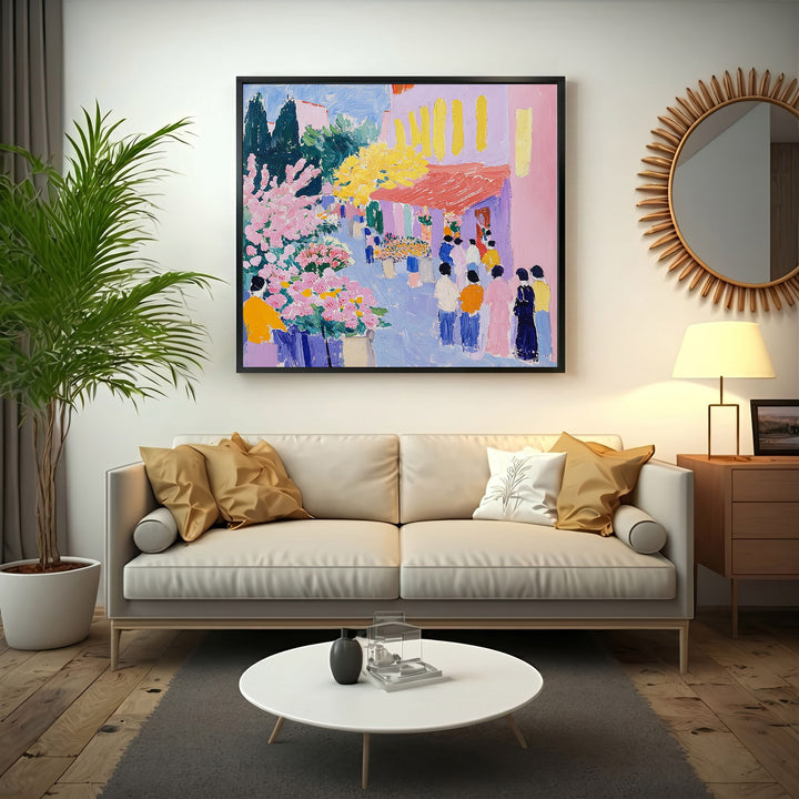 Wadi Home vibrant street scene painting with pink flowers, yellow trees, and people in colorful attire.