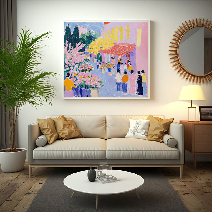 Wadi Home vibrant street scene painting with pink flowers, yellow trees, and people in colorful attire.