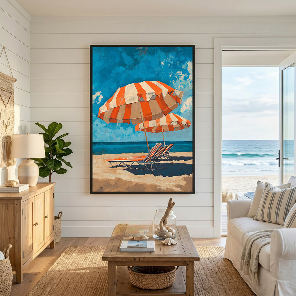 Wadi Home orange and white striped beach umbrellas and lounge chairs on sandy shore with blue sky and ocean.