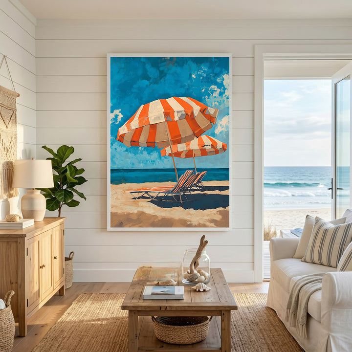 Wadi Home beach scene artwork with orange and white striped umbrellas and lounge chairs on a sandy beach.